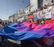 Participants display a bisexual pride flag during a 2019 pride parade in Lisbon, Portugal