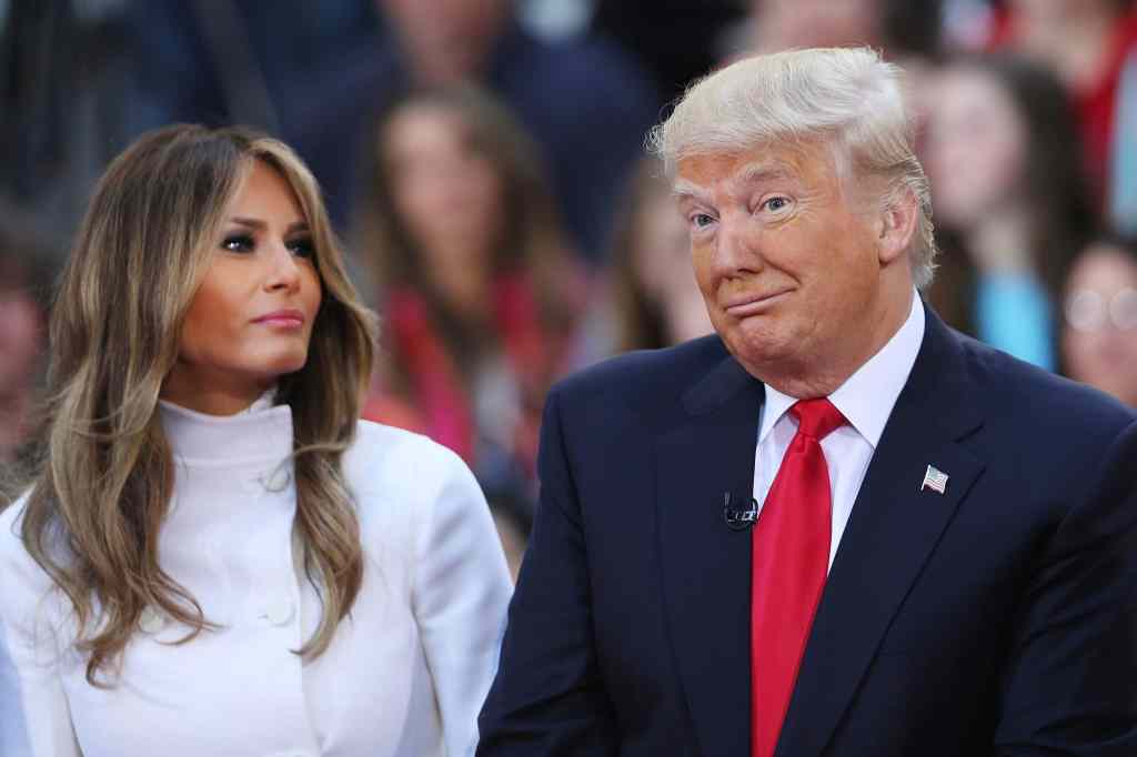 Donald Trump sits and his wife Melania Trump. (Spencer Platt/Getty Images)