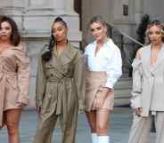 The four members of Little Mix standing on a London street