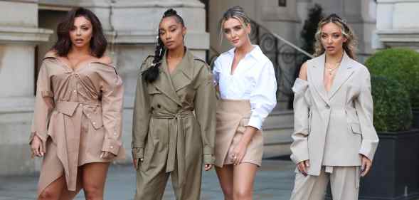 The four members of Little Mix standing on a London street
