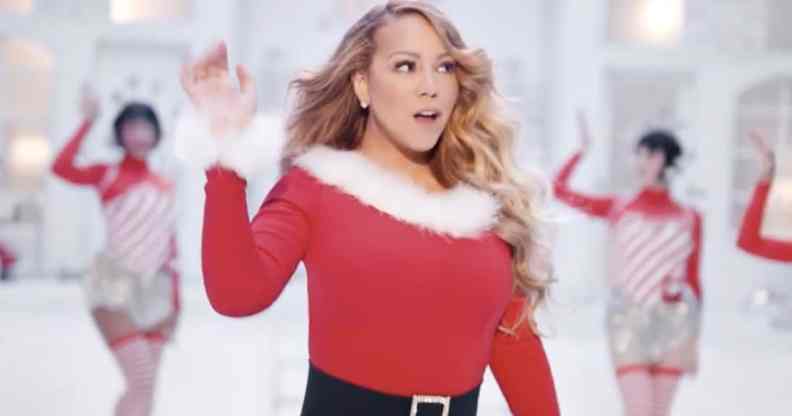 Mariah Carey performs 'All I Want For Christmas Is You' in a Santa-themed dress with festive back-up dancers behind her