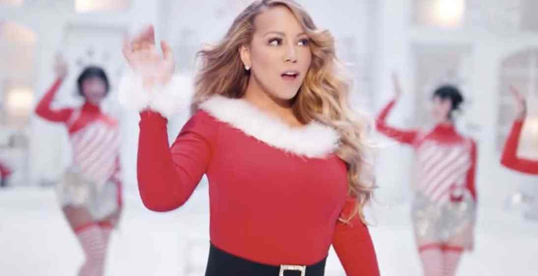 Mariah Carey performs 'All I Want For Christmas Is You' in a Santa-themed dress with festive back-up dancers behind her