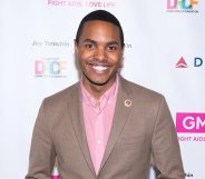 Out gay congressman Ritchie Torres in a brown suit jacket and pink shirt