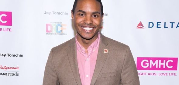 Out gay congressman Ritchie Torres in a brown suit jacket and pink shirt