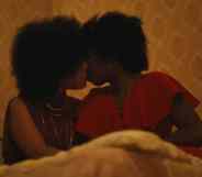 Two Black women kissing in Lovers Rock