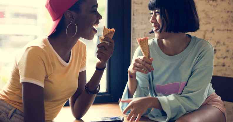 Two women eating ice cream cones