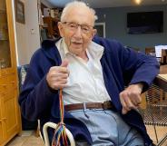 Captain Tom Moore poses with rainbow laces to champion LGBT+ inclusion in sport