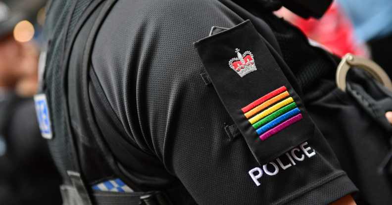 A Met police officer wearing rainbow epaulettes at Pride in London