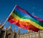 Pried flag held in front of the houses of parliament