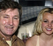 Jamie Spears in a brown jacket and Britney Spears in a vest smile at the camera