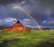 A rainbow over a barn in Wyoming