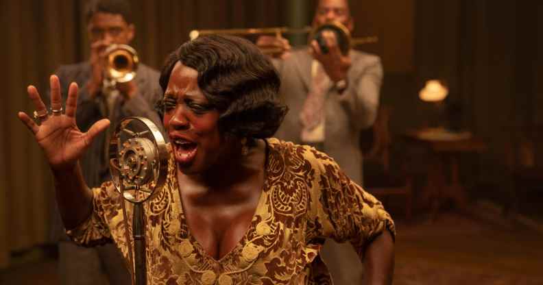 Chadwick Boseman as Levee, Viola Davis as Ma Rainey and Colman Domingo as Cutler in a recording studio