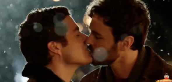 Ben Lewis and Blake Lee kiss in The Christmas Setup on Lifetime