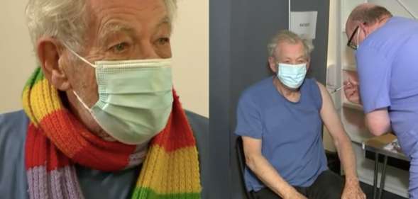 Ian McKellen receives the coronavirus vaccine while wearing a rainbow scarf and face mask
