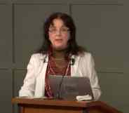 Jennifer Roback Morse founder of the Ruth Institute, stands behind a podium as she delivered a presentation