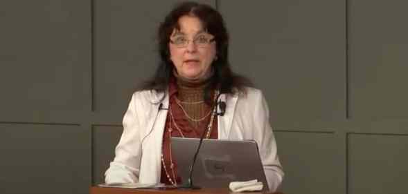 Jennifer Roback Morse founder of the Ruth Institute, stands behind a podium as she delivered a presentation
