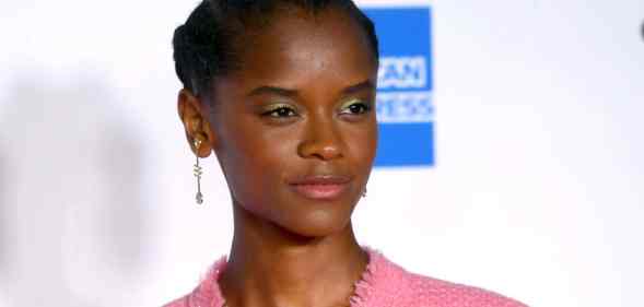 Letitia Wright in a pink suit jacket