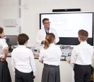 Teacher addressing students in a high school