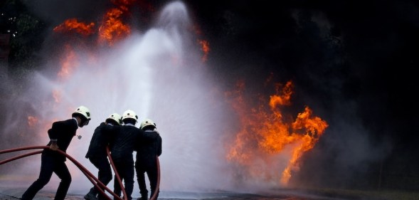 Firefighter putting out a fire