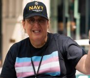 Monica Helms flying a tiny trans Pride flag and wearing a t-shirt with it emblazoned on