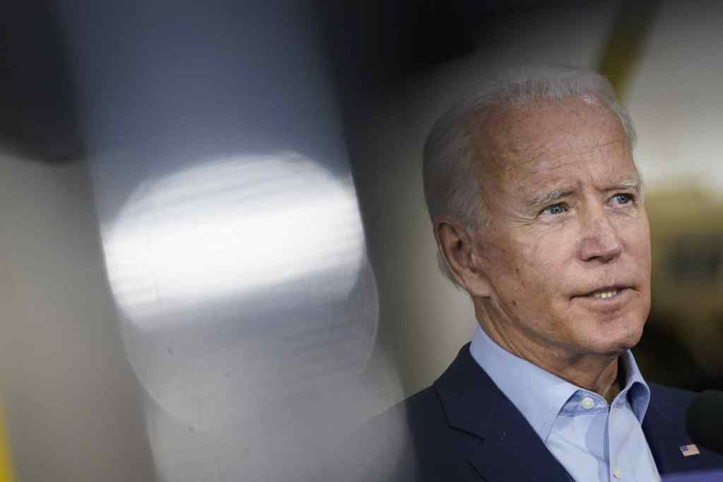 Joe Biden in a light blue shirt and dark suit