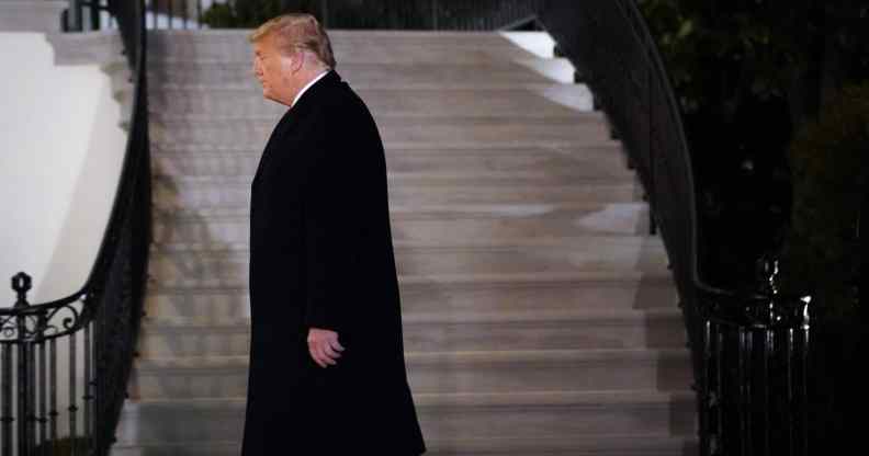 President Donald Trump walks to the White House residence on January 12