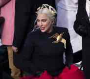 Lady Gaga departs from a podium after signing the national anthem