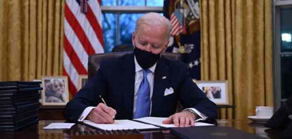 US president Joe Biden prepares to sign a series of orders in the Oval Office of the White House