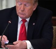 Richard Grenell boss President Donald Trump works on his phone during a roundtable at the State Dining Room of the White House June 18, 2020