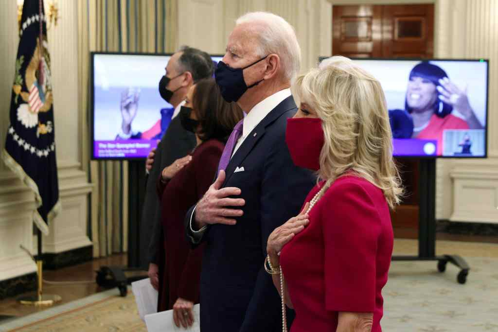 US president Joe Biden, first lady Dr Jill Biden, Vice President Kamala Harris and Second Gentleman Doug Emhoff watch the virtual presidential inaugural prayer service