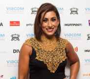 Saira Khan poses in a gold and black dress