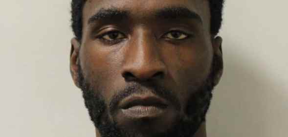 A mugshot of Joel Osei