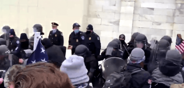 Protestors attempting to break into the Capitol.