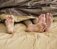 Caucasian couple lying on bed together