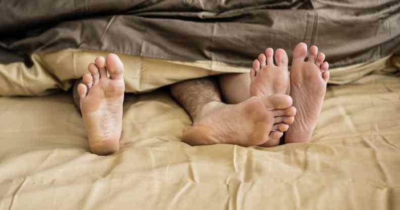 Caucasian couple lying on bed together