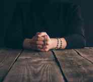 Nun praying with rosary