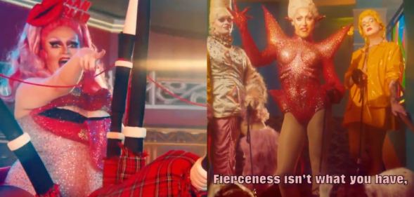 Lawrence Chaney rides giant bagpipes while other queens pose outside an entrance