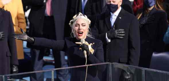 Lady Gaga singing in front of Joe Biden
