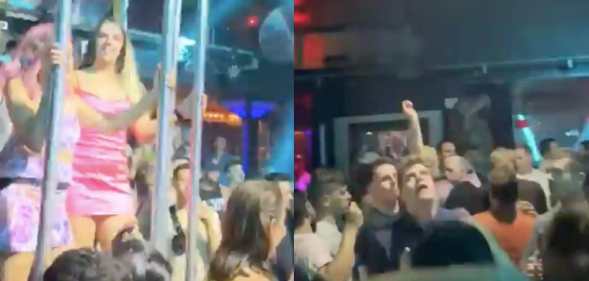 Partygoers at Melbourne queer bar Poof Doof bopping to Lady Gag