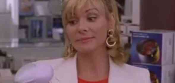 Samantha Jones holding a back massager
