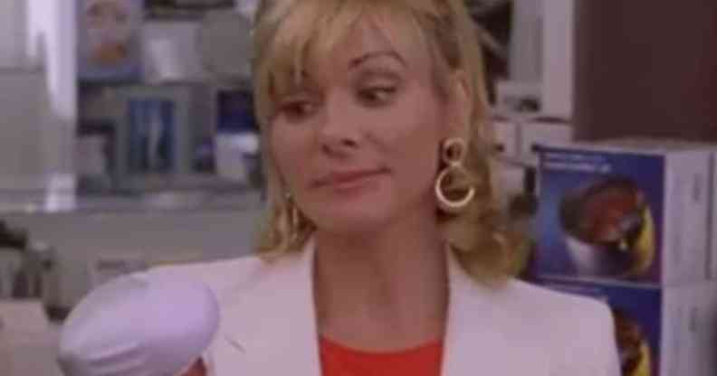 Samantha Jones holding a back massager