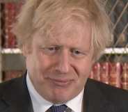 Boris Johnson squirms in a suit