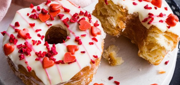 The love nut Yumnut, a croissant-doughnut covered in white icing and red hearts