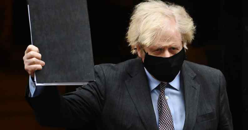 British prime minister Boris Johnson leaves Downing Street on his way to the House of Commons to deliver a statement on the governments four-step plans to release England from the current lockdown