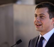 Secretary of transportation Pete Buttigieg speaks in front of a podium