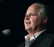 Rush Limbaugh speaks into a microphone