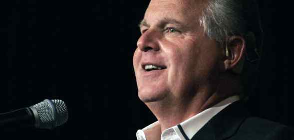 Rush Limbaugh speaks into a microphone