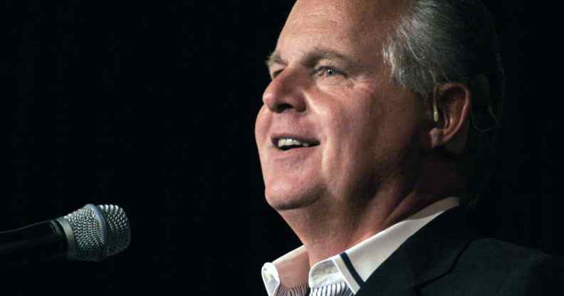 Rush Limbaugh speaks into a microphone