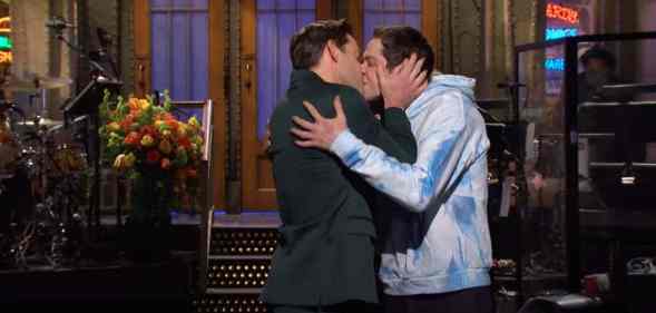 John Krasinski and Pete Davidson share a kiss on the set of Saturday Night Live