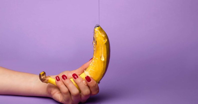 A banana being covered in honey